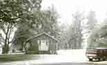 The log cabin in the winter