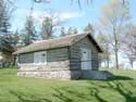 The log cabin in the spring